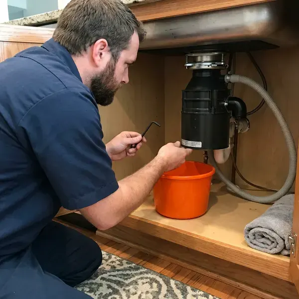 KRV Plumbing technician providing garbage disposal repair in Wichita, KS